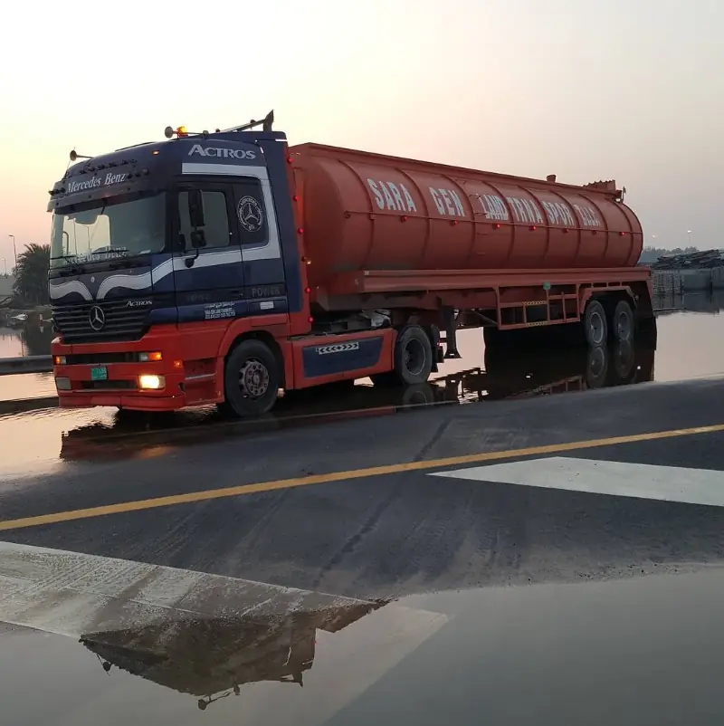 Sara General Land Transport Mercedes-Benz Actros sewage tanker truck on a Dubai road at dusk