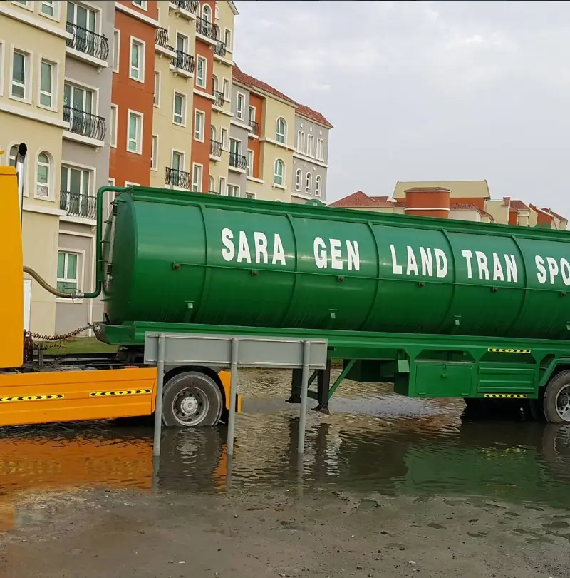 Sara General Land Transport sewage tanker truck servicing a residential community in Dubai
